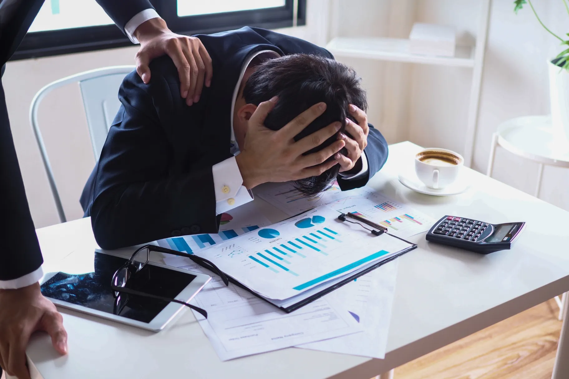 Male businessmen support and encourage colleagues who are fired